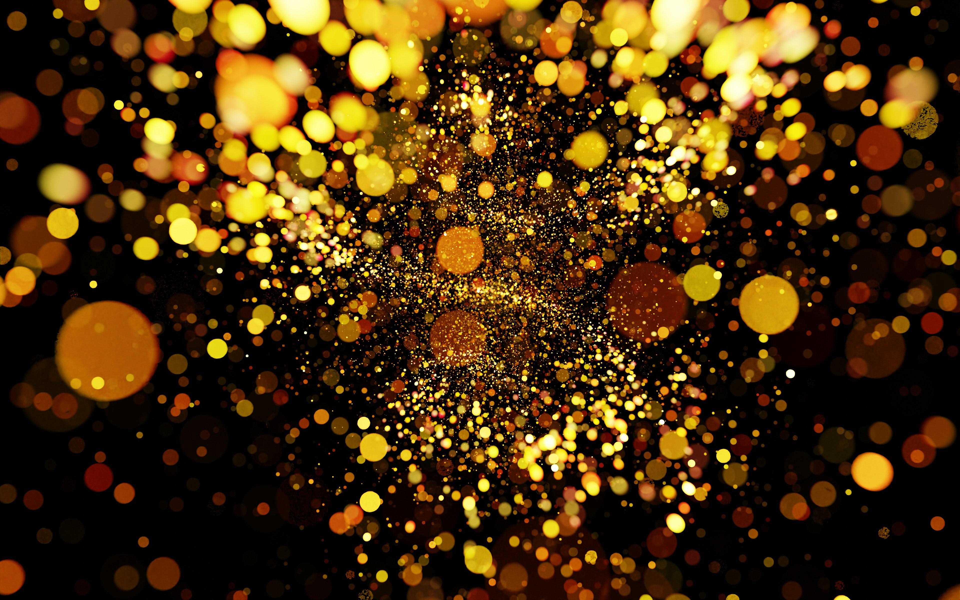 A burst of golden lights against a dark background, creating a dazzling and dynamic effect.